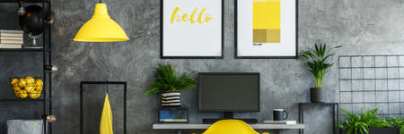 Horizontal view of stylish loft with two posters on the wallの写真素材