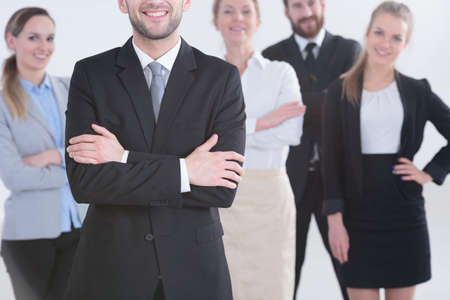 Professional smiling office workers standing in a groupの写真素材