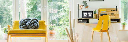 Modern digital clock standing on the desk in simple home officeの写真素材