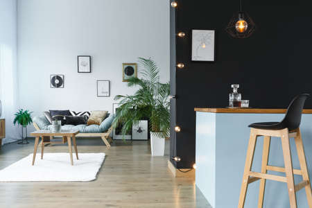 Black and grey lounge area with kitchen annexの写真素材