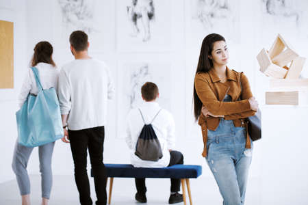 Opening of an art exhibition including paintings and sculpturesの写真素材