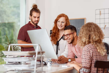 Team of young coworkers brainstorming together in the officeの写真素材