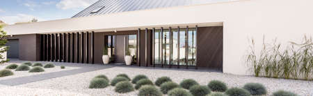 Spacious garden with little stones and green plantsの写真素材