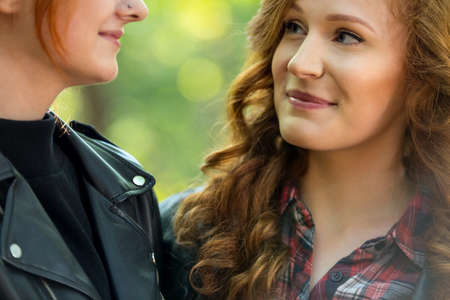 Close-up of smiling girls faces looking at each other