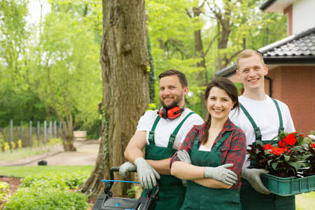 Portrait of enthusiastic gardeners in a green summer backyardの写真素材