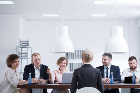 Board of managers asking an employee questions during an annual performance review in a corporationの写真素材