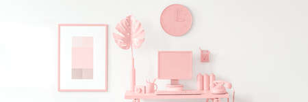 Phone and monstera leaf on desk against white wall with clock and poster in peach workspace interiorの写真素材