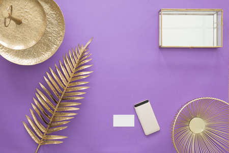 Gold leaf and vase on ultra violet background with mockup and copy spaceの写真素材