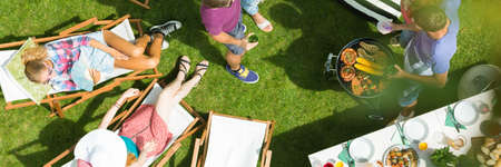 Friends spending summer together having a barbecue partyの写真素材