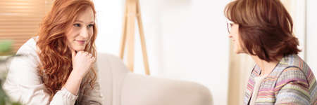 Personal life coach talking to her client during a sessionの写真素材