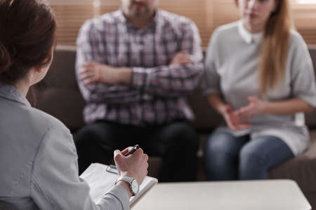 Close-up of therapist for couples analyzing the behavior of spousesの写真素材