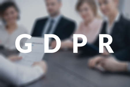 Team of coworkers discussing the new data protection legislation during a business meeting. GDPR conceptの写真素材