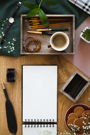 Top view on notes with copy space on wooden desk with ink and pen. Real photo with an empty space for your textの写真素材