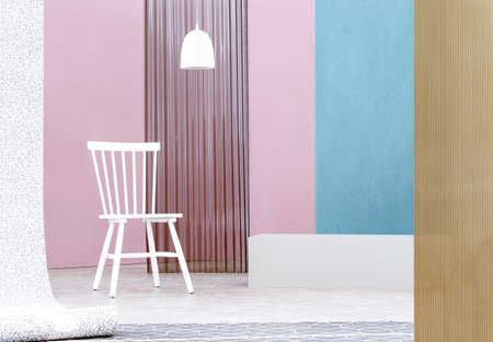 Real photo of a white lamp above wooden chair in spacious interior with pastel blue and pink walls as well as plastic screensの写真素材