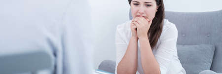 Panorama of crying woman with family problems in support centre