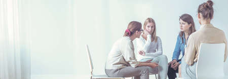 Women listening to a therapist during a session. Empty space, place your posterの写真素材