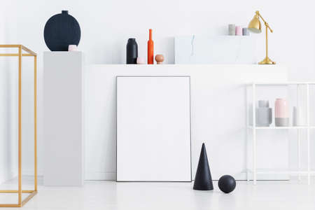 Black cone and ball on the display of art's gallery, real photo with mockupの写真素材