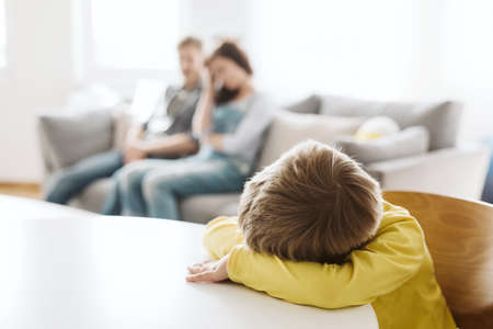helpless parents and their badly behaving son at homeの写真素材