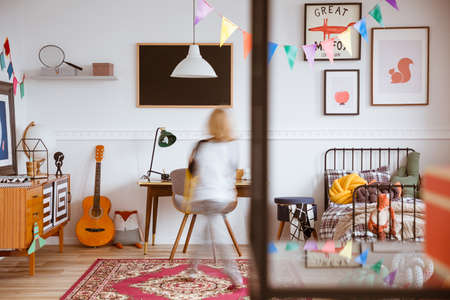 Vintage style genderless child room with bed and desk
