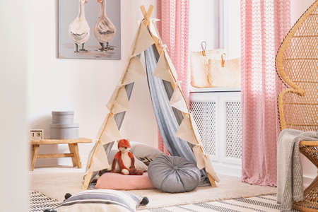 Tent with pillows and toy in the middle of children's playroom in modern house, real photoの写真素材