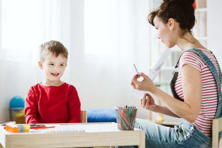 In therapy, kid is learning skills that don't come naturally because of ADHD, like listening and paying attention betterの写真素材