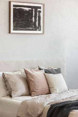 Trendy bedroom with comfortable king size bed in modern flat, real photoの写真素材