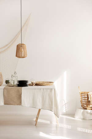 Bright white living room with table in the centerの写真素材