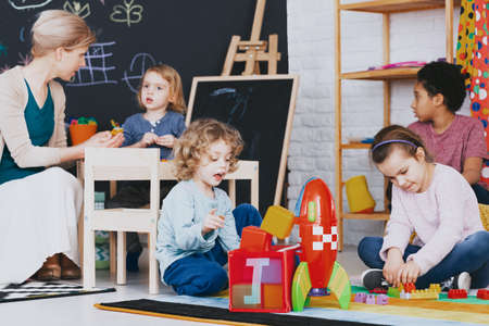 Multicultural group of kids playing together during after classesの写真素材
