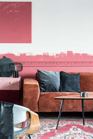White and red ombre wall of chic living room interior in classy apartment