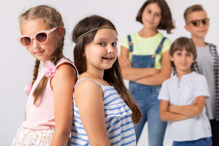 Two girls at the dressing up party with group of friendsの写真素材