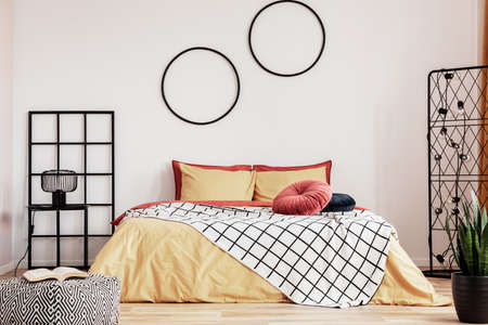 Yellow and ginger bedroom design with black accents