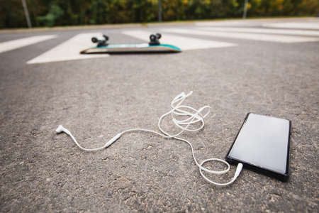 Phone on the street after skateboard accident