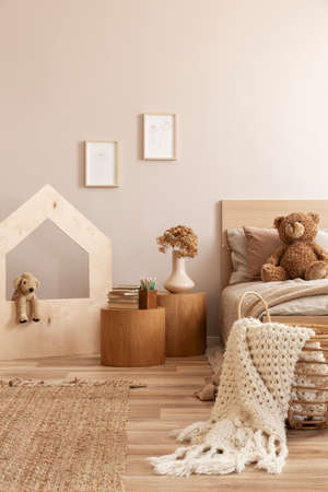 Fashionable kid's bedroom with wooden furniture and toysの写真素材