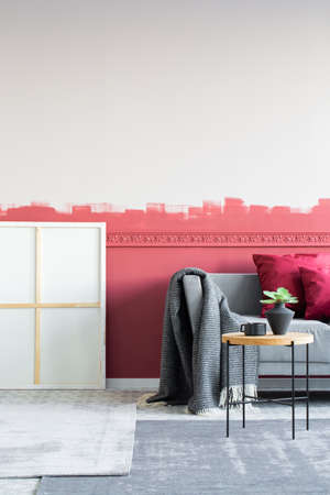 Elegant and modern living room interior with grey sofa with pillows and coffee tableの写真素材