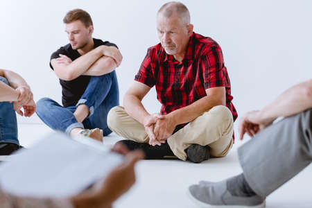Group of men exercising their imagination during psychotherapyの写真素材