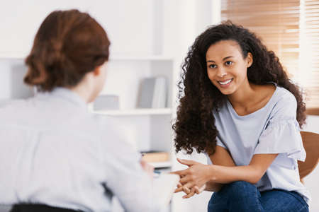 Professional psychotherapies and young woman suffering from ptsdの写真素材