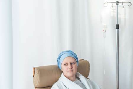 Young woman wearing scarf during chemotherapyの写真素材