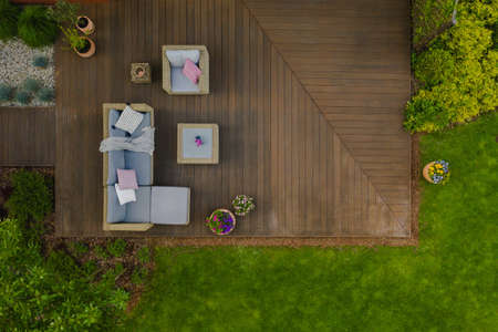 Top view of wooden terrace with comfortable wicker garden furnitureの写真素材