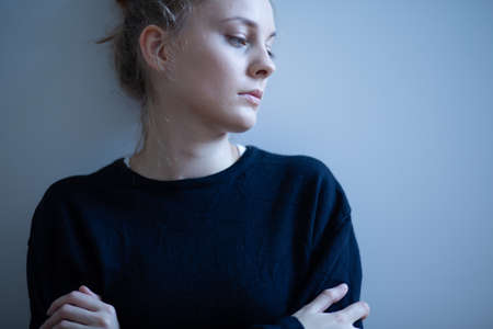 Portrait of young sad woman with anxiety disorder, anorexia ans loneliness conceptの写真素材