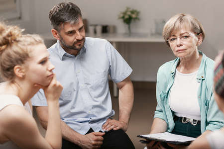Group psychotherapy with professional counselor for people with social problemsの写真素材