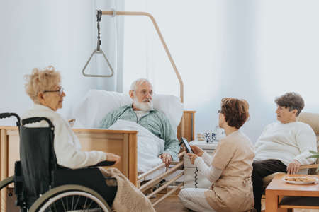 Grpup of older people spending time together in nursing homeの写真素材