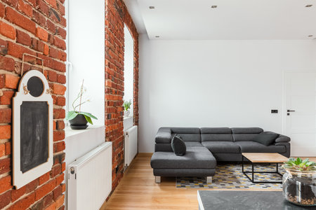 Red brick wall in contemporary apartment interiorの写真素材