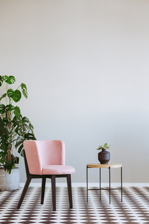 Stylish living room with trendy furniture, copy space on empty wallの写真素材