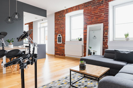 Simple modern apartment with drums and brick wallの写真素材