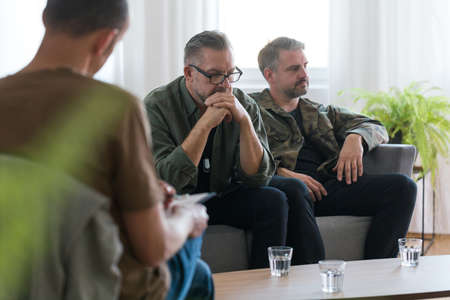 Two veterans talking about the trauma on psychotherapyの写真素材