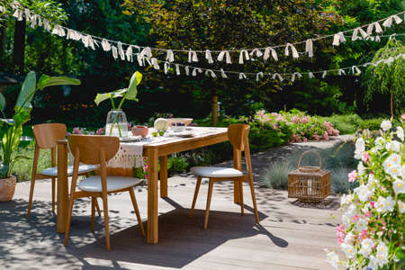 Wooden and frattan decorations in the summer gardenの写真素材