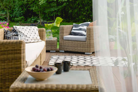 Modern design of living room set on a wooden porchの写真素材