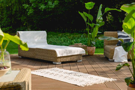 Rest space with chaise lounge in the gardenの写真素材