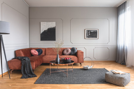 Abstract black and white painting on gray empty wall of contemporary living room interiorの写真素材