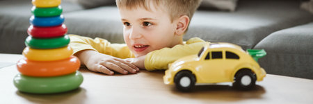 Young school kid with autism playing with kids on a therapyの写真素材
